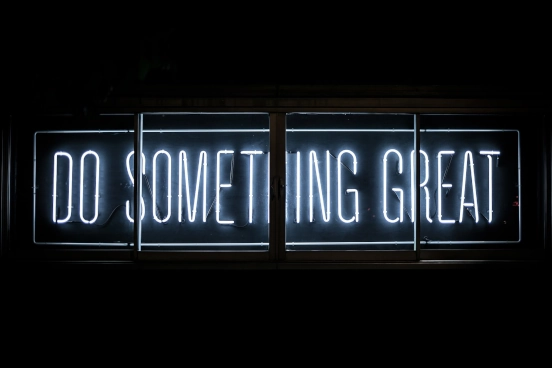An image of neon writing used by the Tech for Good Alliance which reads 