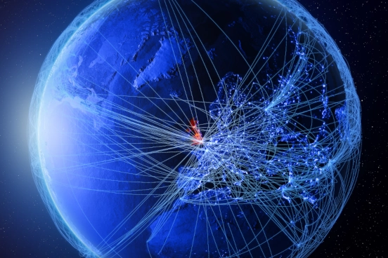 An image showing a representation of planet Earth shown with cris-crossing lines connecting cities.