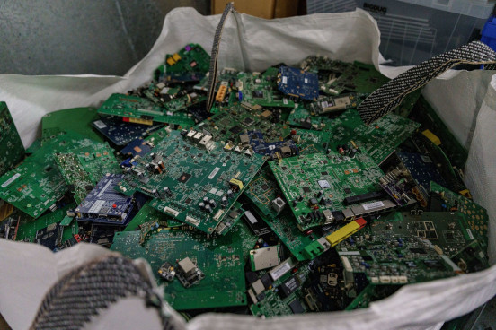 An image of old circuit boards piled up in a large sack